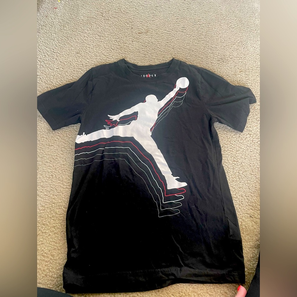 Brand new. Never worn. 
Jordan Black T-Shirt with Jumpman Logo